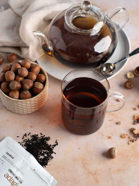 Adagio's Hazelnut flavor combines the full, bright taste of Ceylon black tea with the cozy creaminess of hazelnuts. Very nutty and aromatic, slightly roasted with a rounded, sweet flavor. Toasty dryness. A mellow, very well-blended cup of tea. Great with just a touch of brown sugar.