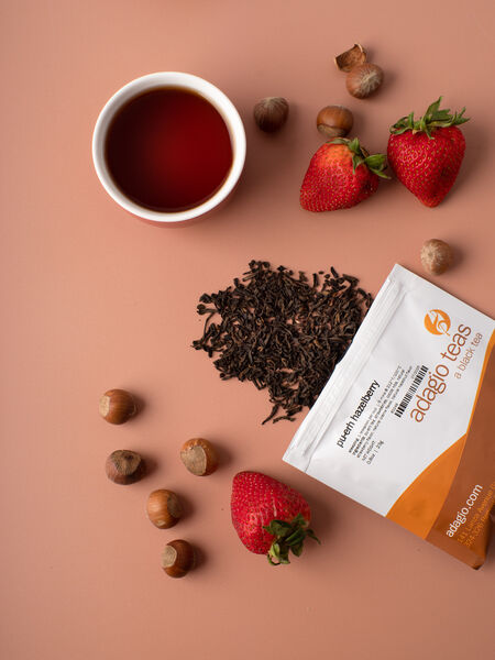The earthy smoothness of Pu Erh creates a warm foundation for the rich flavor of hazelnut while playful, tangy-sweet strawberries peek through the nutty opulence. A hint of cream adds a soft, dreamy note to the blend.