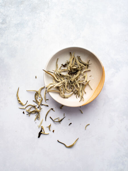 From Junshan Island in the Hunan Province of China, this beautiful Jun Shan Yin Zhen yellow tea boasts very beautiful sage downy green and silvery buds. The dry aroma is melon and maybe a little muscatel. Cup is creamy, light and really looks like a nice Silver Needle, however, the cup also offers hints of toastiness and a soft muscat grape-like fruitiness. Very complex and layered. Just lovely.